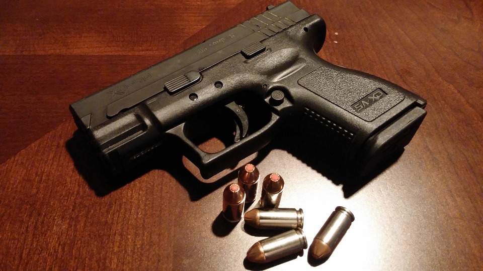 Gun and gold bullets. 